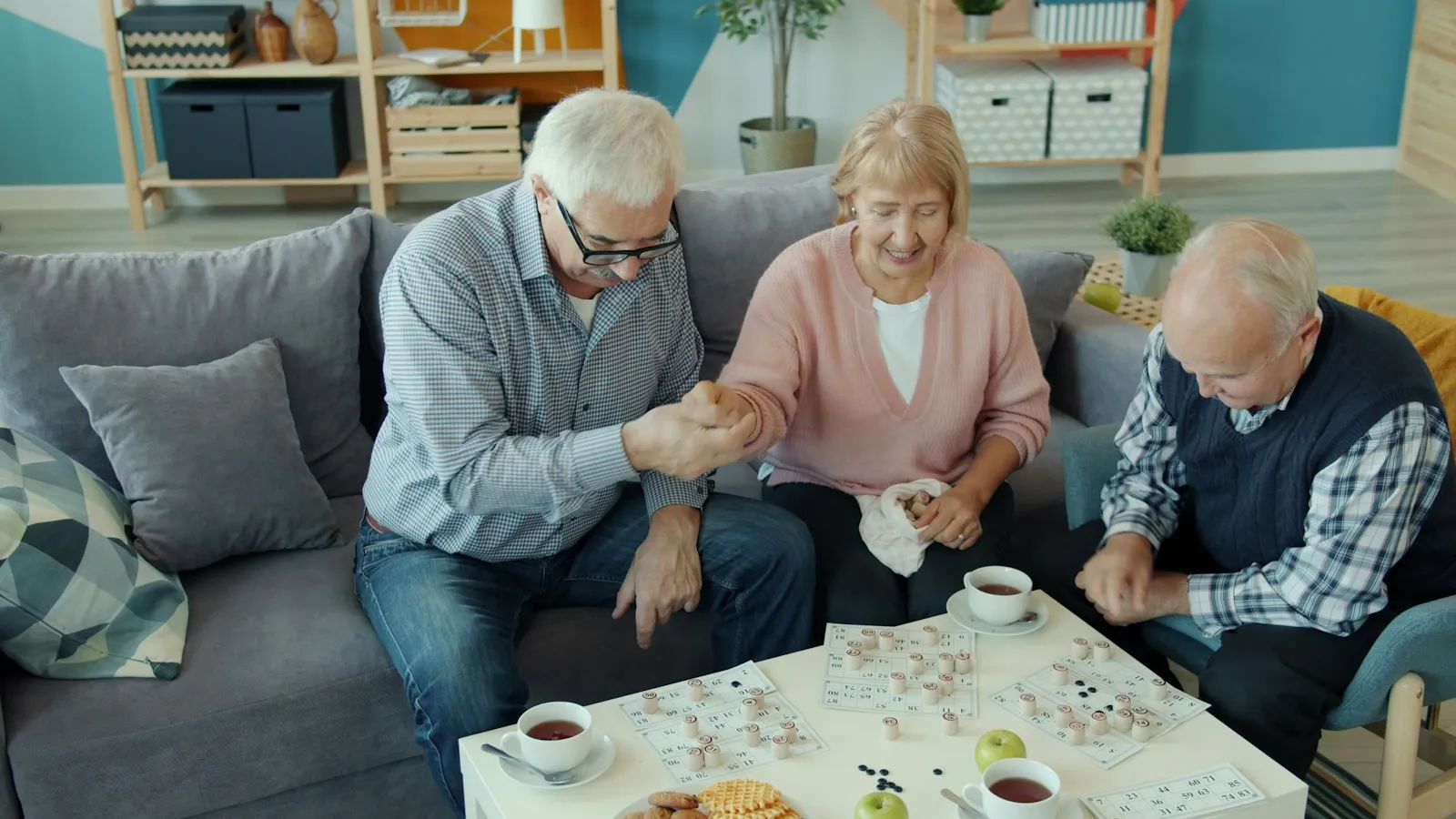 Friends working on a puzzle together over tea